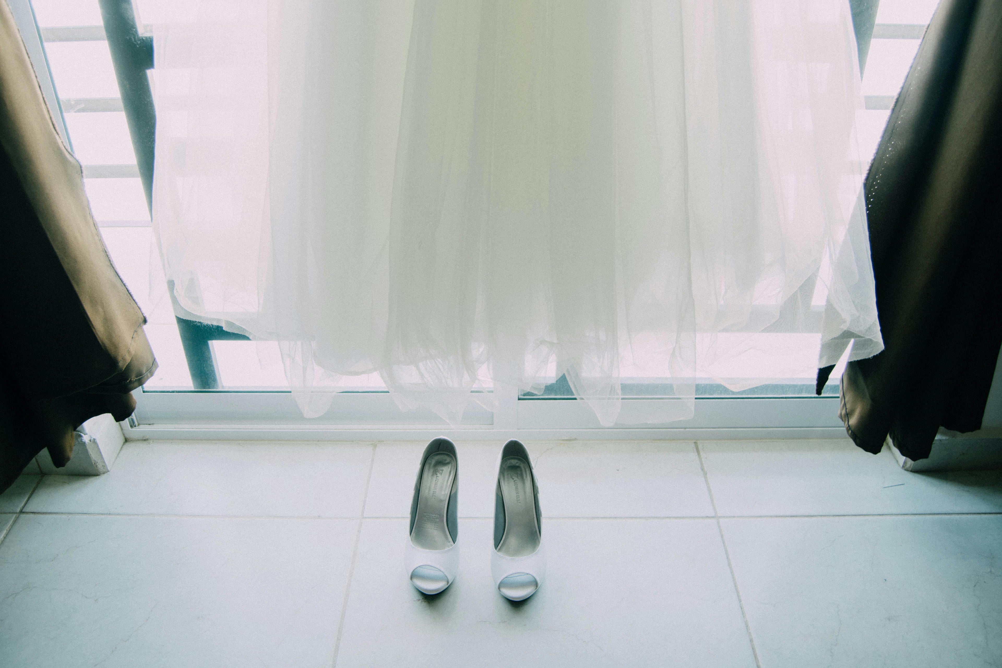 Wedding hanging by the window with heels